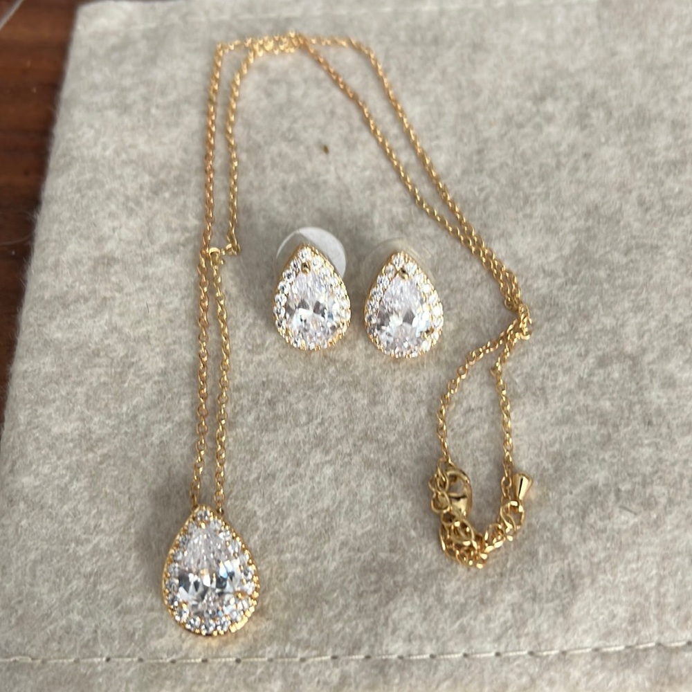 Crystal teardrop necklace and earring set. Gold tone. Chain 16-18” adjustable.